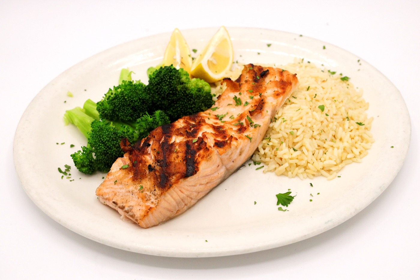 Grilled salmon dinner with rice and broccoli