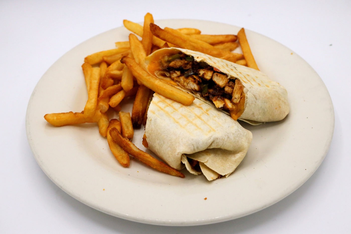 Chicken wrap served with golden french fries